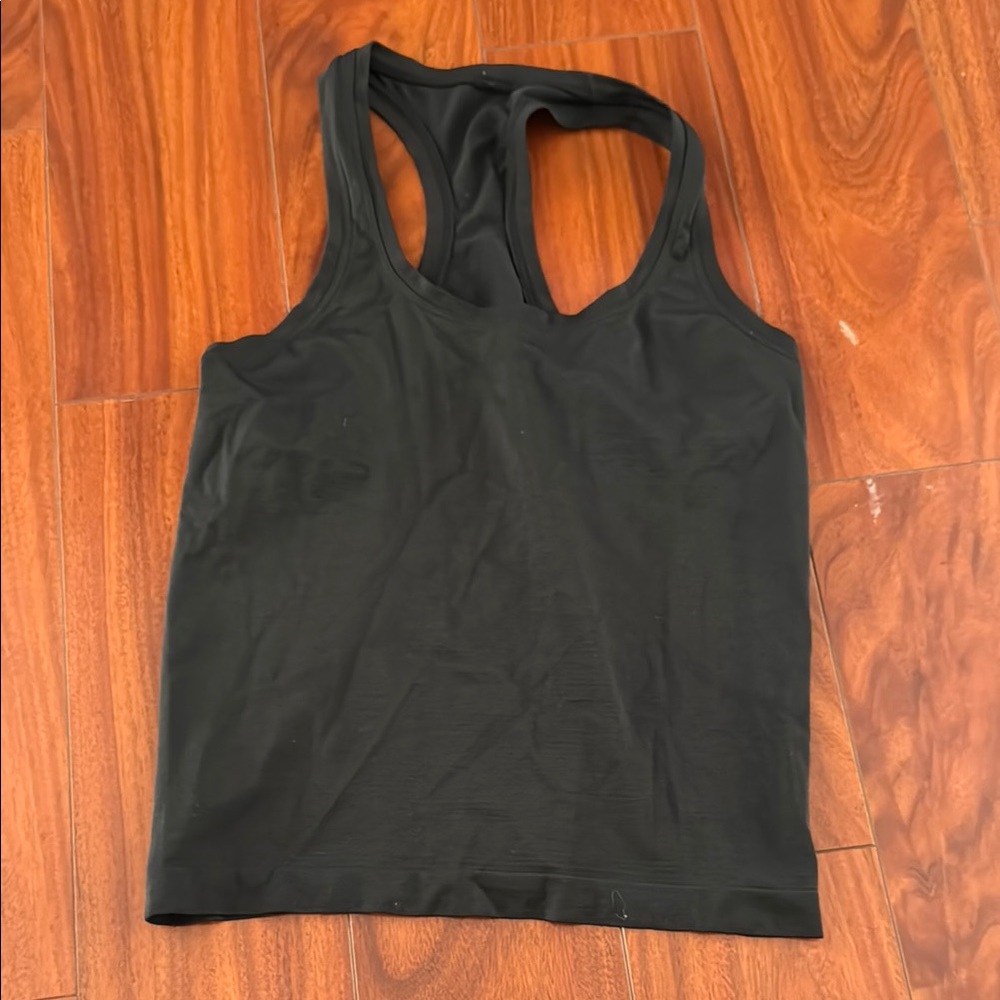 Size 6 lululemon swiftly tech racerback tank waist length.